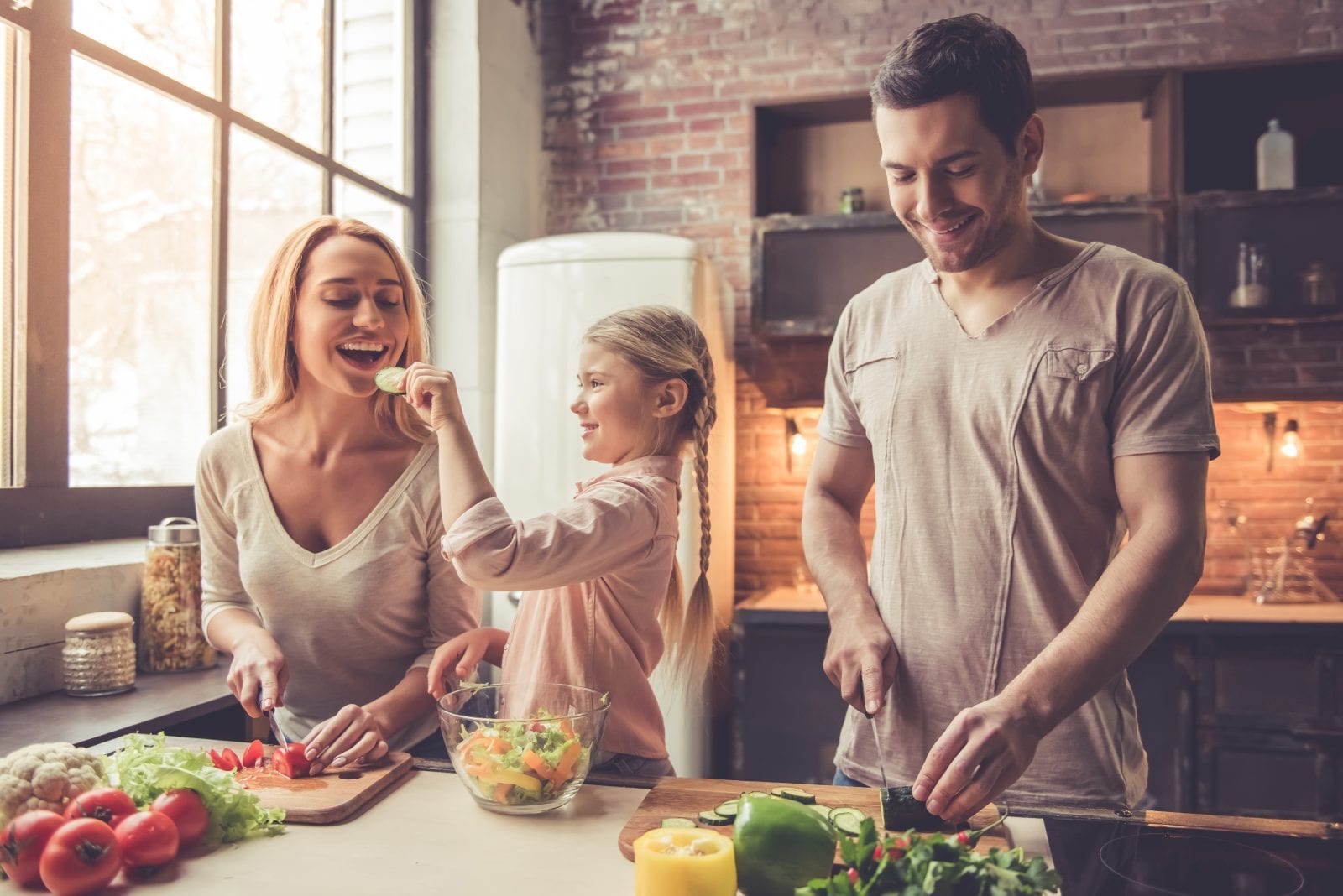 Young family cooking healthy